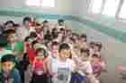 Children and teacher together during a group activity — approved staging media